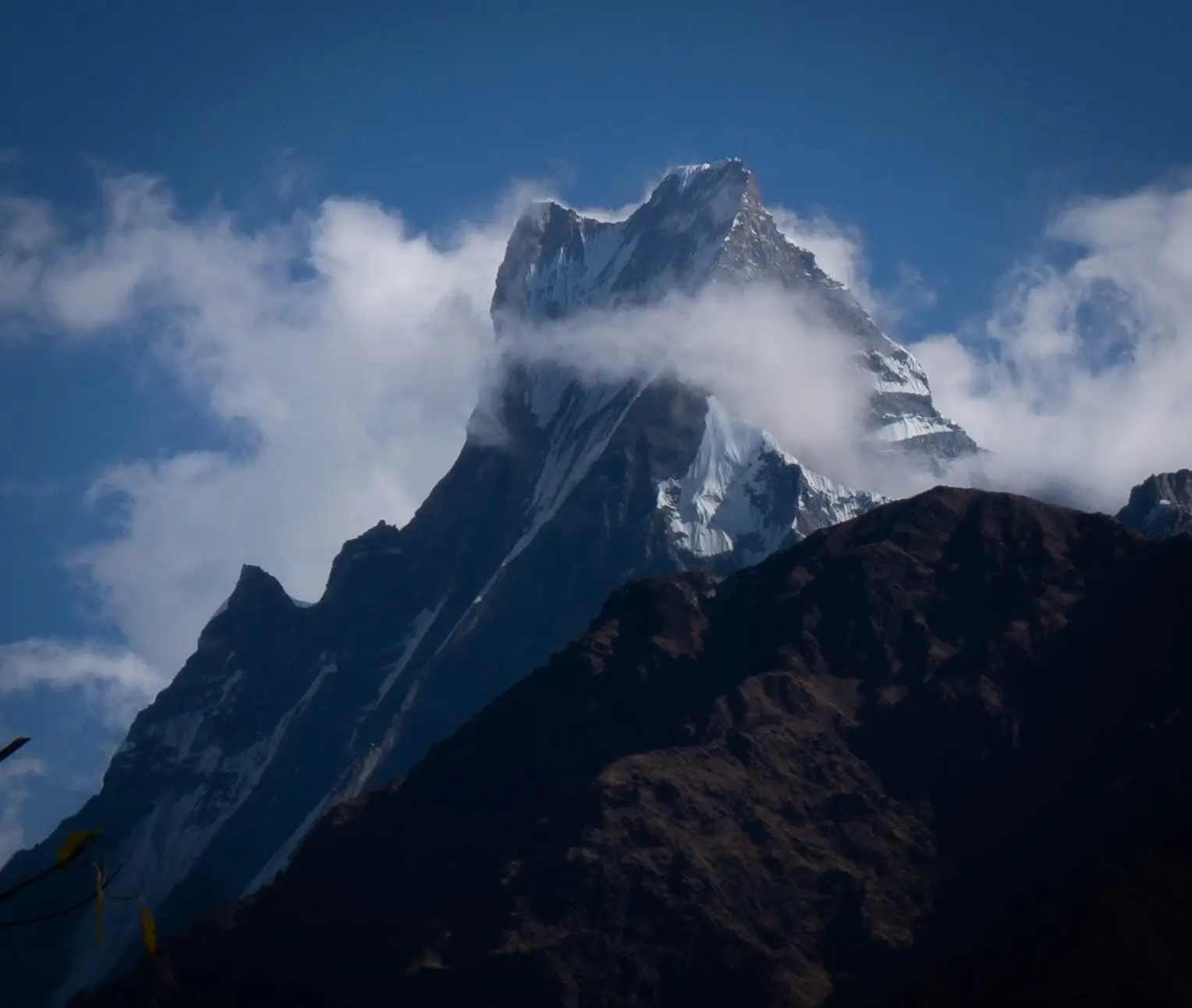 Mt. Machhapuchhre with hanging clouds on the ABC trek